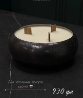Handmade scented soy candle in a clay container with 3 wicks