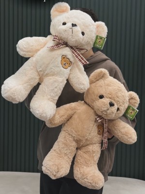 Teddy bear with a bow in a plaid print
